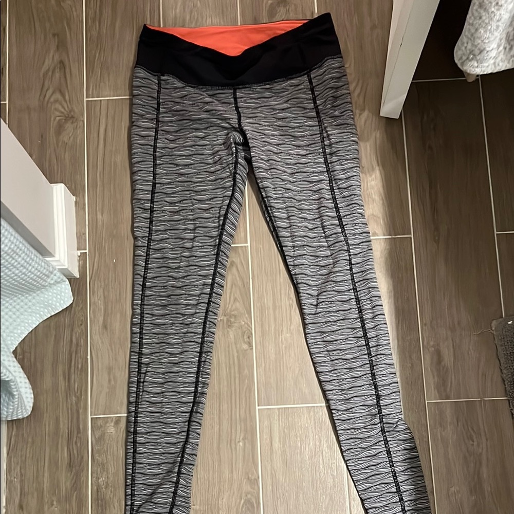 Lululemon Athletica Gray and Black Leggings with Orange Waistband